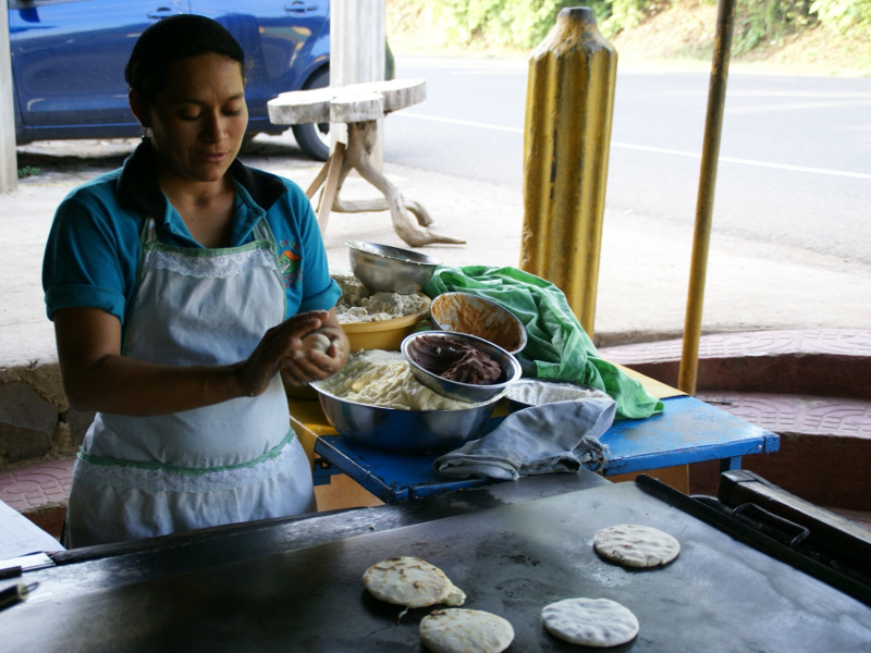 Woman making pupusas