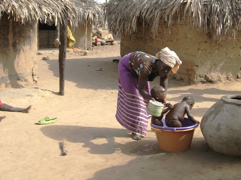 Senegalese mother bathing children