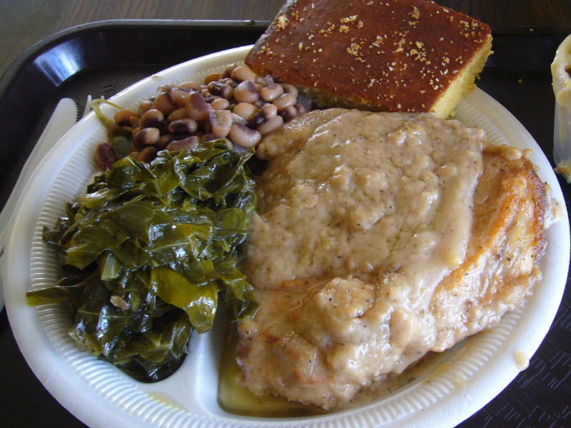 Plate with smothered pork chops