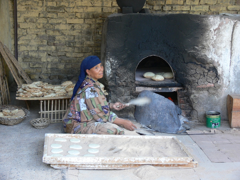 Woman baking pita bread