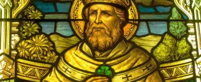 Stained glass of St. Patrick with a shamrock