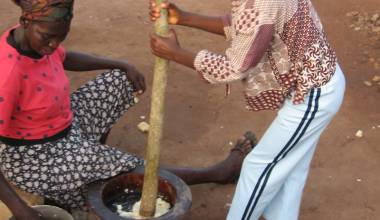 Women making fufu