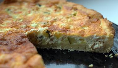 Quiche lorraine with a slice missing