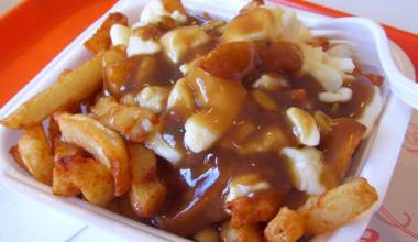 Poutine (Canadian fried potatoes with gravy and cheese curds)